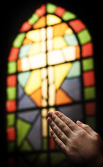 Praying Hands And Stained Glass Church Window