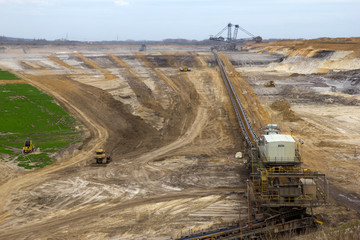 A conveyor-belt and excavator in a brown-coal mine