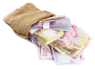 Burlap bag with Ukrainian money, isolated on white