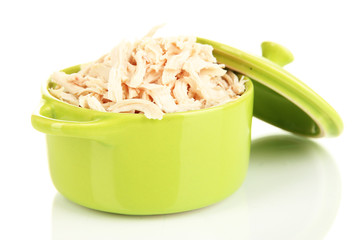 Shredded boiled chicken in green pan isolated on white