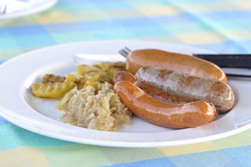 Grilled sausage on white dish