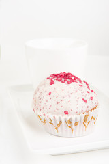 Mug and a cake over white