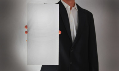 Businessman showing a blank card