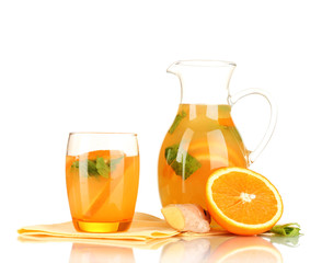 Orange lemonade in pitcher and glass isolated on white