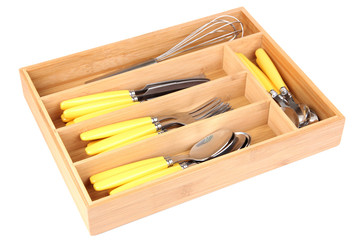 Wooden cutlery box with checked cutlery isolated on white