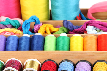 Sewing accessories in wooden box close up