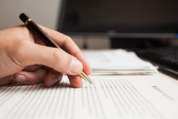 Man checking text on a business document