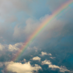 Grunge cloud sky with rainbow background