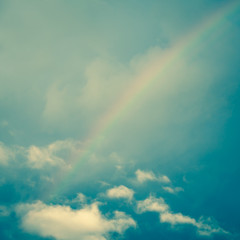 Fototapeta na wymiar Grunge cloud sky with rainbow background