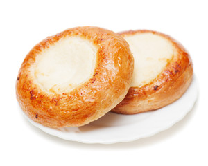 Fresh buns muffins with cottage cheese on white background.
