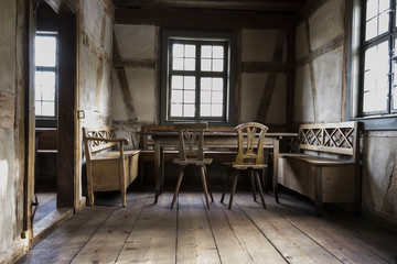 rustic chamber with bench, table and chair.
