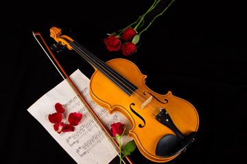 Fototapeta na wymiar Violin sheet music and rose