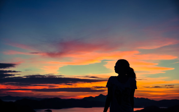 silhouette of young girl's side portrait  when sunset