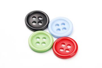 Buttons Scattered on White Background