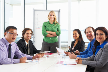 Fototapeta premium Businesswoman Conducting Meeting In Boardroom