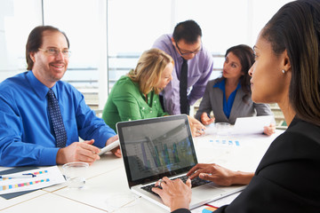 Businesspeople Meeting In Boardroom