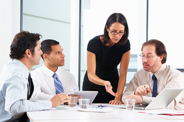 Group Of Businesspeople Meeting In Office