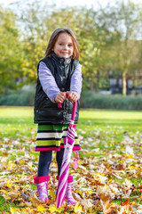 Autumn girl with umbrella