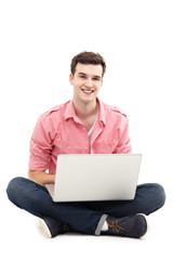 Young man sitting with laptop