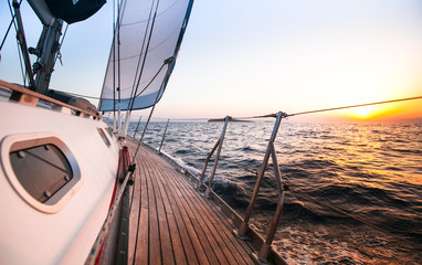 Sailing regatta in Greece, during sunset. - obrazy, fototapety, plakaty