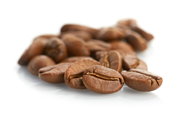 Macro of coffee beans isolated on white background