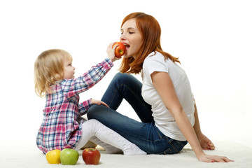 Fototapeta premium Mother and child with apples.