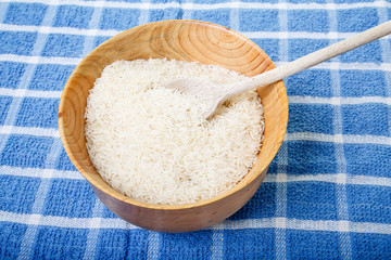 White Rice in Wood Bowl on Blue Towel