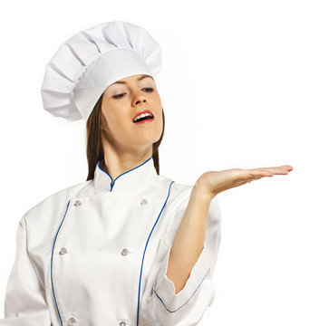 Young cook in the studio on a white background