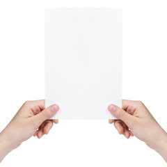 two female teen hands holding blank paper sheet