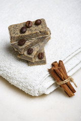 Handmade flavored soap bars with coffee beans and cinnamon