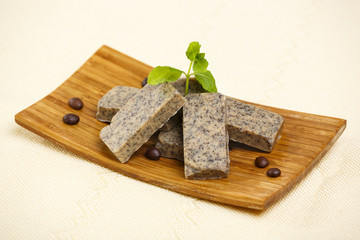 Handmade soap bars on wooden stand