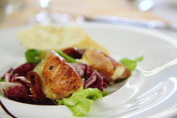 mozzarella grilled in the pig ham as gourmet food background