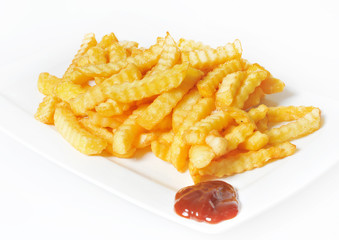 A Serving of fries with barbecue sauce