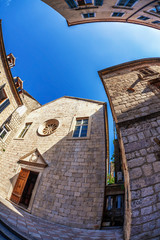 Fish-eye view of the old city on sky background