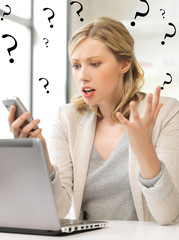 confused woman with cell phone