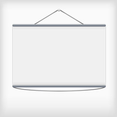 White projection screen hanging from wall