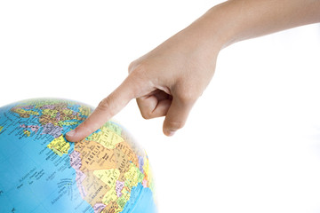 A Finger pointing to Spain in a World Globe
