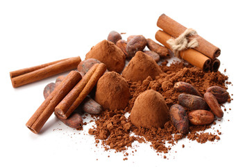 Chocolate truffles, cocoa and spices isolated on white