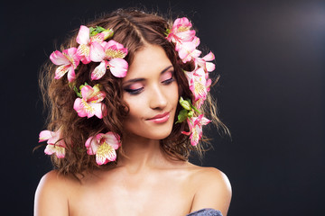 Beautiful woman with flowers in her hair