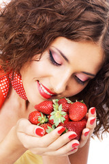 Lovely woman with handful of strawberry