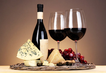 Refined still life of wine, cheese and grapes