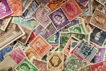 Colorful Vintage Used Postage Stamps - obrazy, fototapety, plakaty