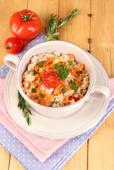 Delicious rice with vegetables and herbs in pot