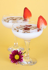 Fruit smoothies on beige background