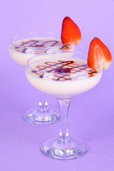 Fruit smoothies on lilac background