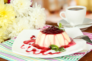Panna Cotta with raspberry sauce, on bright background