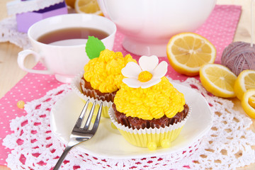 Beautiful lemon cupcakes and flavored tea