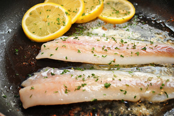 Cooking White Fish with Lemon Slices