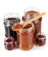 Tasty jam in banks isolated on white