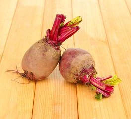 Young beets on wooden table close-up